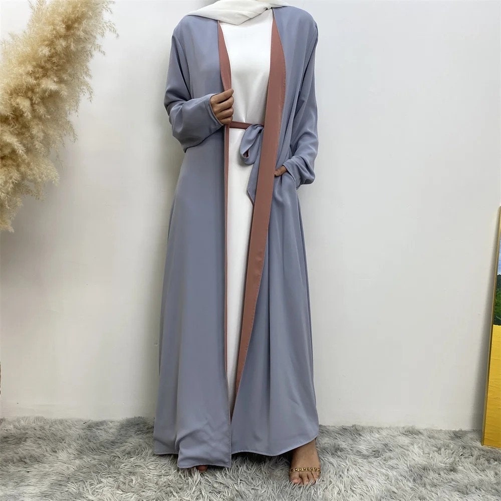 long dresses, one maroon and one brown, on a neutral background.