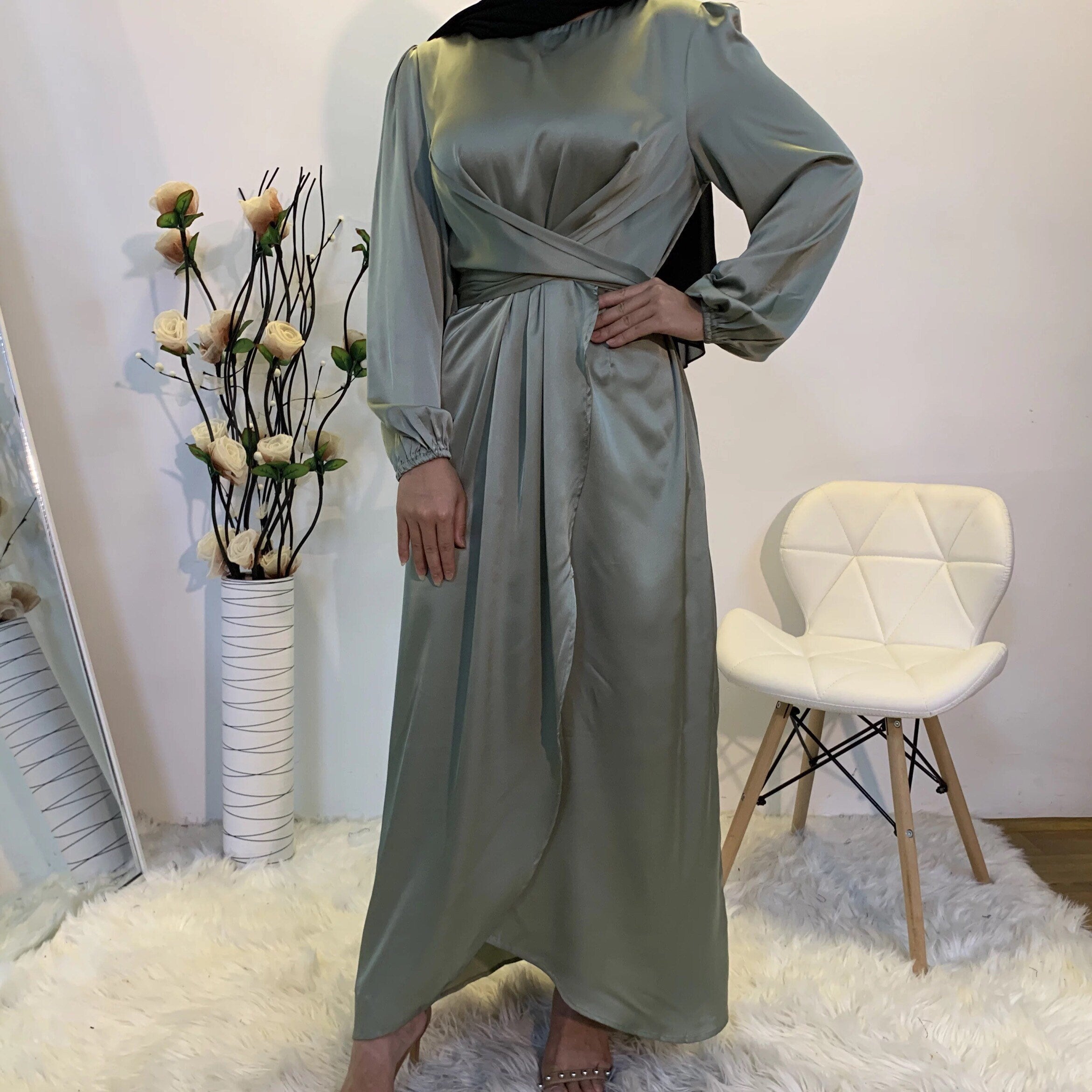Long purple dress on a mannequin satin hijab dress