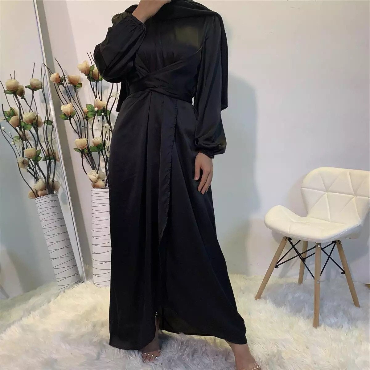 Long purple dress on a mannequin satin hijab dress