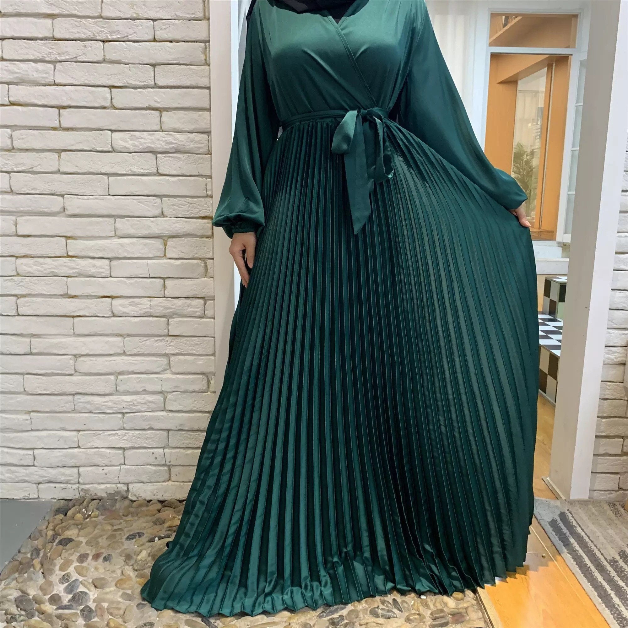 Pleated satin dress with belt