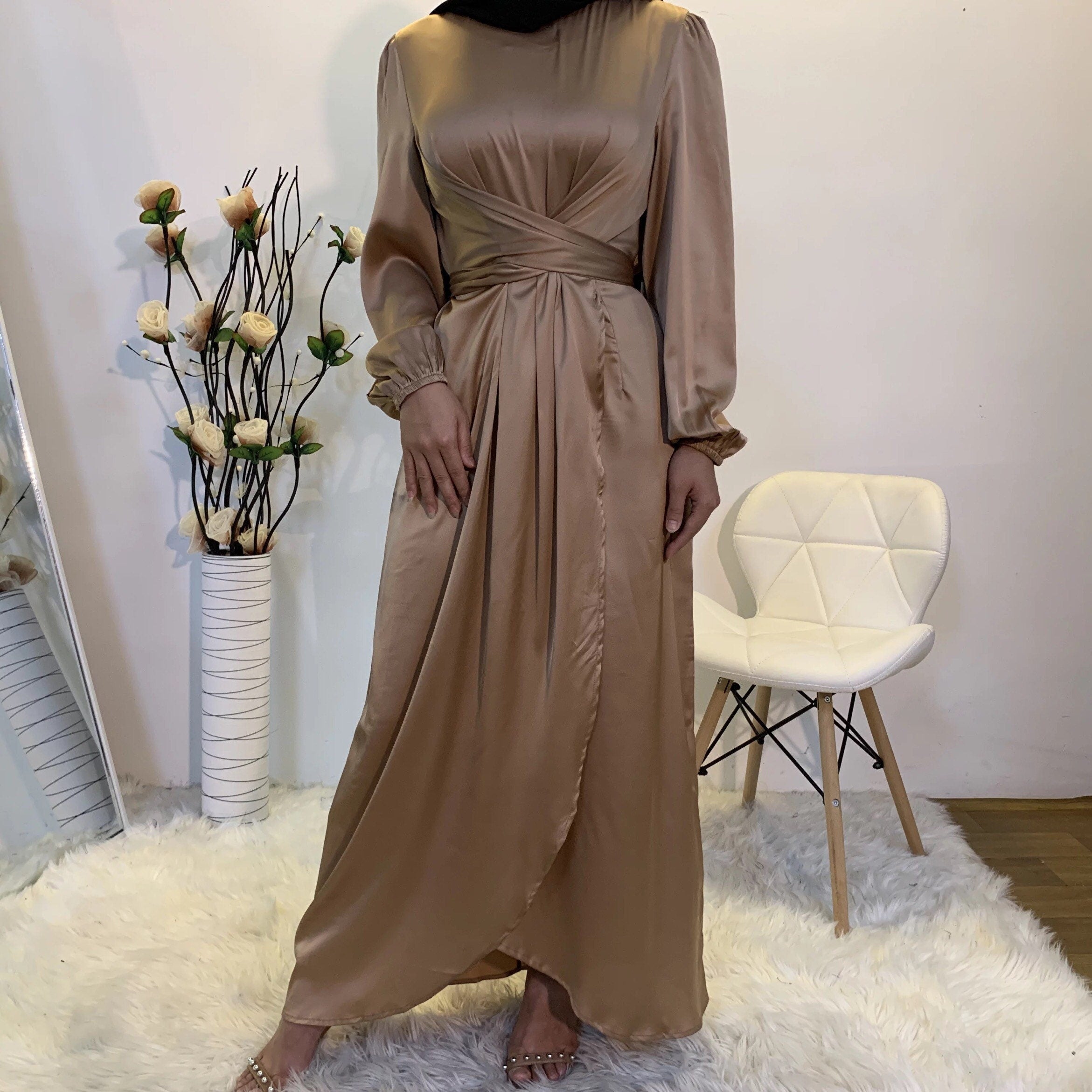 Long purple dress on a mannequin satin hijab dress