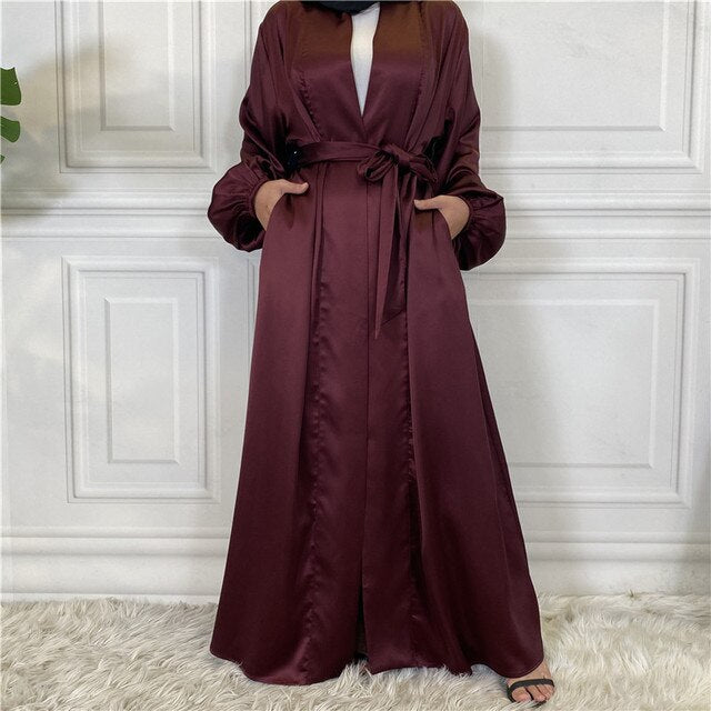 Maroon long dress with a belt on a white background