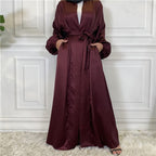 Maroon long dress with a belt on a white background